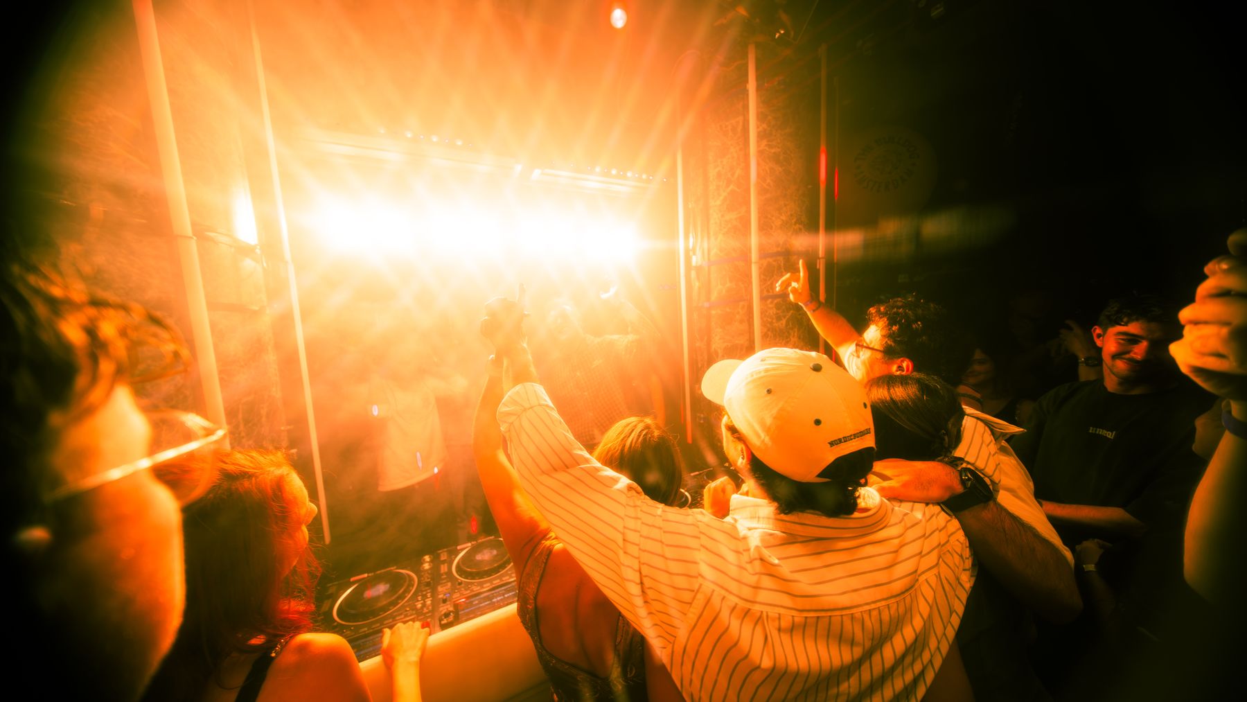 Hands up in front of the DJ booth